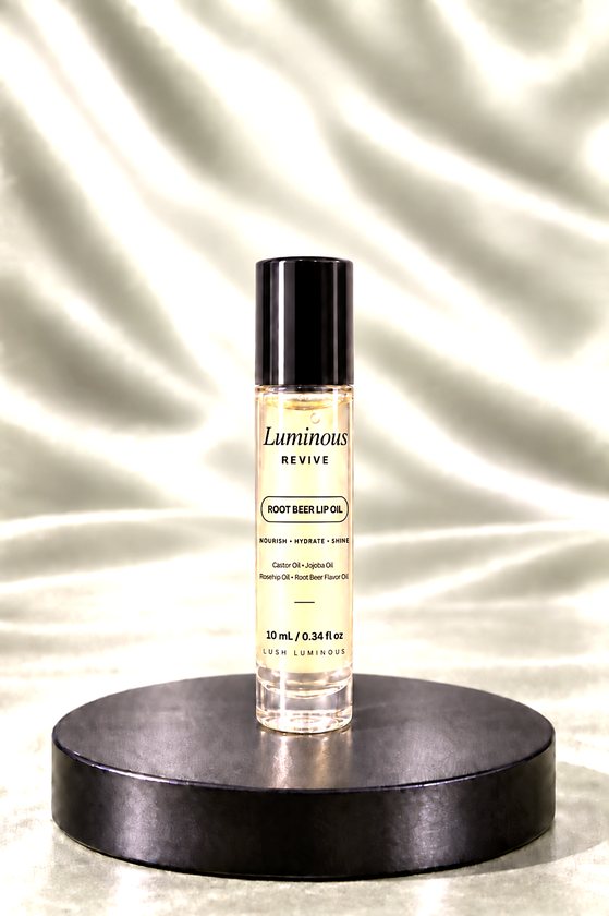 Luminous Revive lip oil in a 10 mL rollerball bottle